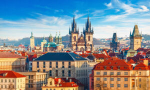 High spires towers of Tyn church in Prague city